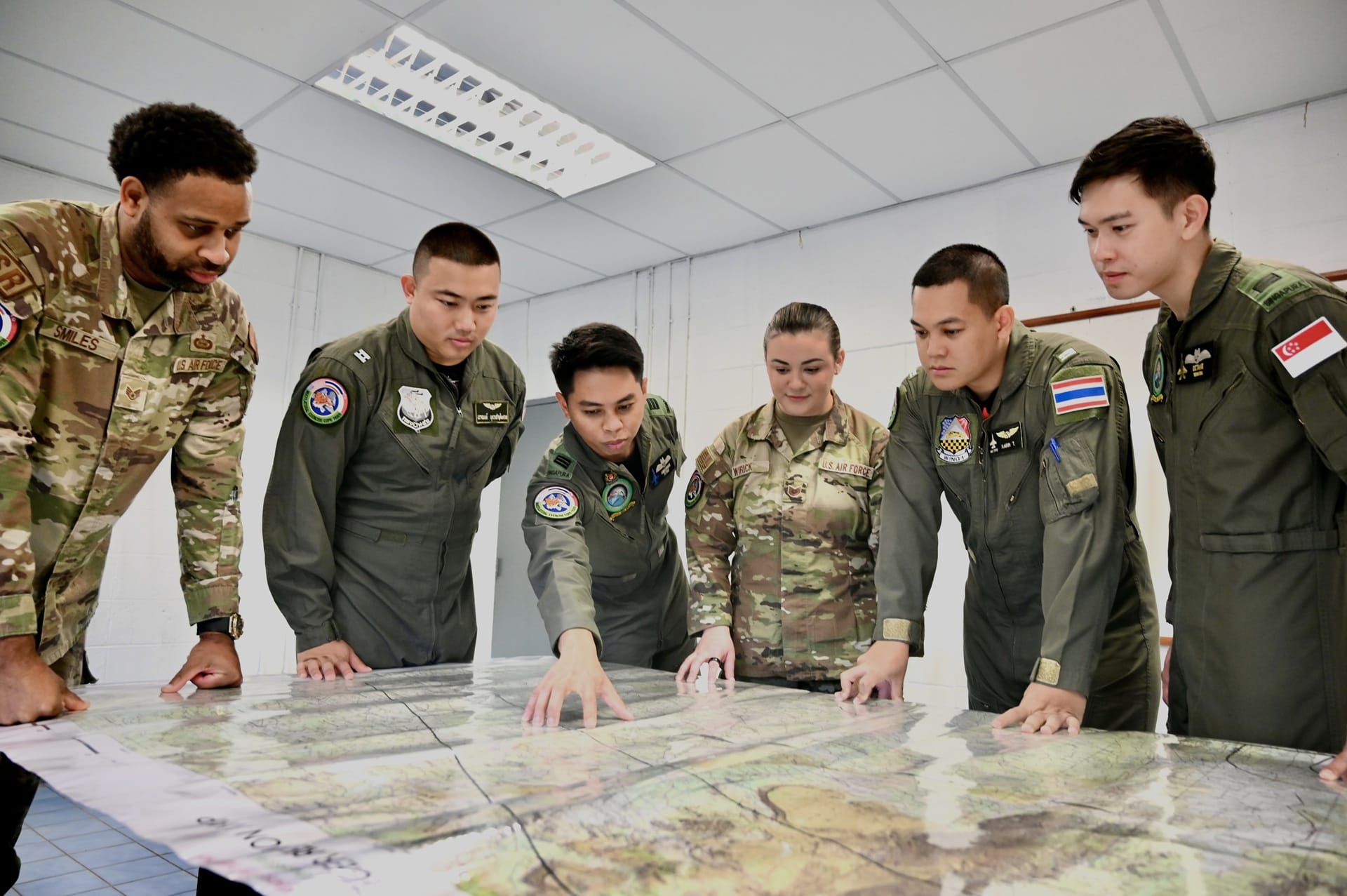 Exercise Cope Tiger (XCT) 2026 participants from the Republic of Singapore Air Force (RSAF), Royal Thai Air Force (RTAF), and United States Air Force (USAF) planning for a mission.